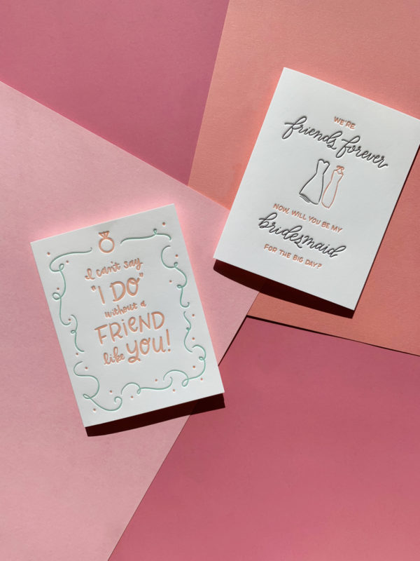 Bridal and wedding greeting cards on a layered pink paper background.