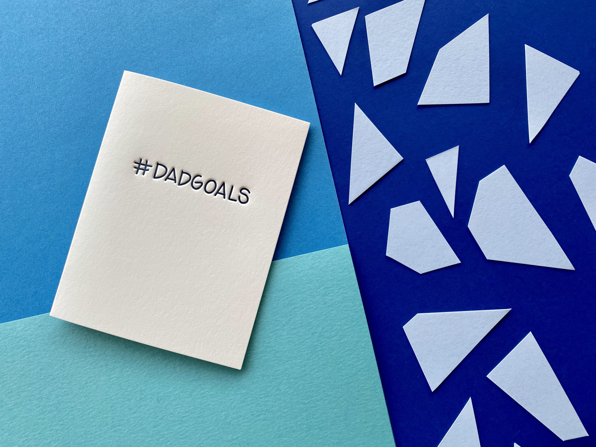 Hashtag dadgoals Greeting Card on layered paper background
