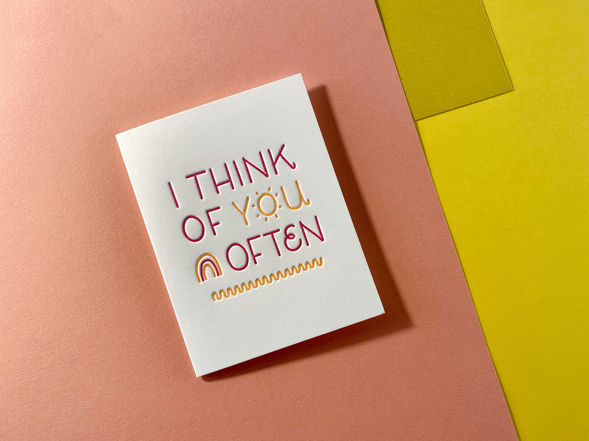 Letterpress greeting card on layered paper background